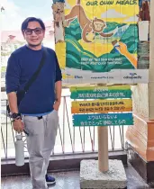  ??  ?? CEBUANO online influencer Dr Xavier Solis at the Juan Effect signage in Loboc River