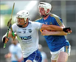  ??  ?? KEY ROLE: Waterford player Tom Devine (left) with Tipp’s Séamus Kennedy