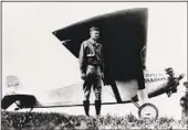  ?? AFP VIA GETTY IMAGES ?? Charles Lindbergh in front of the Spirit of St. Louis at Paris-Le Bourget after his solo nonstop flight.