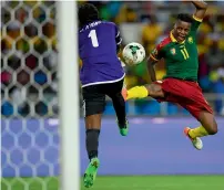  ?? AFP ?? Gabon’s goalkeeper Didier Ovono (left) prepares to block a shot on goal by Cameroon’s forward Edgar Salli. —