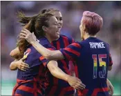  ?? RICK BOWMER — THE ASSOCIATED PRESS ?? Sofia Huerta, left, Alex Morgan, rear, and Megan Rapinoe celebrate a U.S. goal in a 2-0 win over Colombia Tuesday.