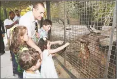  ??  ?? Above: some photos of people visiting the Kuwait Zoo.