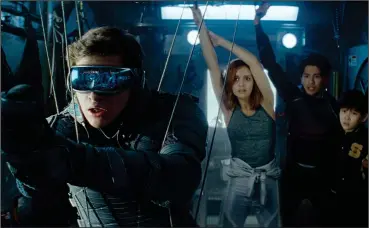  ?? Warner Bros. Pictures ?? Tye Sheridan as Wade Watts, Olivia Cooke as Samantha Cook, Win Morisaki as Daito and Philip Zhao as Sho in “Ready Player One.”