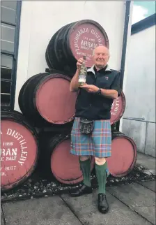  ??  ?? Campbell Laing shows off the whisky that is being auctioned to raise funds for the Waverley.