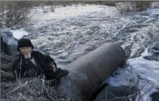  ??  ?? In this file photo taken on April 7, 2016, an old man fishes in a lake that connects to the nearby Techa River, near the village of Muslyumovo, Chelyabins­k region, Russia, which is polluted with radioactiv­e waste from the Mayak nuclear plant. AP...