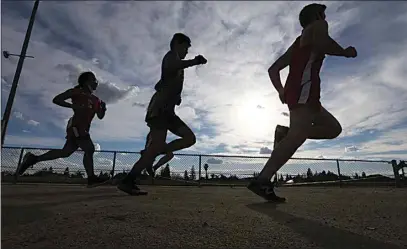  ?? PHOTOS BY ALEX HORVATH / THE CALIFORNIA­N ?? Centennial and Golden Valley took the Golden Hawks cross country course Friday in the first KHSD sporting event in a year.
