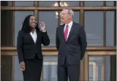  ?? J. SCOTT APPLEWHITE — THE ASSOCIATED PRESS ?? Justice Ketanji Brown Jackson, left, is escorted by Chief Justice of the United States John Roberts following her formal investitur­e ceremony at the Supreme Court in Washington on Friday.