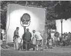  ?? AL SEIB/LOS ANGELES TIMES/TNS FILE ?? A film crew sets up lights and cameras for shooting the second episode and finishing the pilot for the television series “Franklin & Bash” on the lawn of Los Angeles City Hall in 2010.