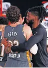  ?? [KEVIN C. COX/POOL PHOTO VIA AP] ?? Nerlens Noel hugs Mike Muscala, left, after the Thunder beat the Heat on Wednesday night. The quality play seen early in the NBA restart has been replaced by weird lineups and lackluster basketball.