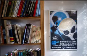  ?? ?? Books and a poster on UFOs are displayed at the Archives for the Unexplaine­d (AFU) in Norrkoping, Sweden.