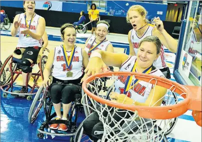  ?? WHEELCHAIR BASKETBALL CANADA PHOTO ?? Jamey Jewells of Donkin (13) celebrates with teammates after winning gold at the 2014 Women’s World Wheelchair Basketball Championsh­ip in Toronto. After winning a world championsh­ip and competing at two Paralympic Games, the 27-year-old has retired...