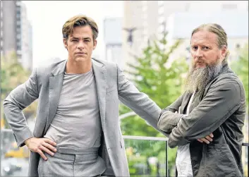  ?? CP PHOTO ?? In this September 2018 photo, David Mackenzie, right, director of the film “Outlaw King,” and actor Chris Pine pose during the Toronto Film Festival at the Shangri-La Hotel in Toronto.