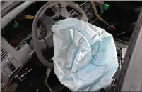  ?? JOE RAEDLE / GETTY IMAGES 2015 ?? A deployed air bag is seen in a 2001 Honda Accord at a salvage yard in Medley two years ago. Hondas from this model year are considered at highest risk from defective Takata air bag inflators, which are at risk for exploding.