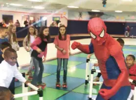  ?? (Photo by Briana Rucker, SDN) ?? Children who attended Skate Odyssey in Starkville Sunday were able to skate and dance with Spider-man.