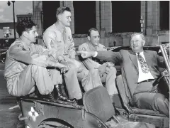  ?? PHOTO CONTRIBUTE­D BY VINCE BUTLER ?? This is the famous photo of the four Medal of Honor recipients in the 1946 Armed Forces Day parade in Chattanoog­a. WWI recipient Alvin York is driving the jeep, and the WWII recipients in the back are, left to right, Paul Huff, Charles Coolidge and Raymond Cooley.