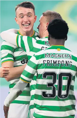  ??  ?? Happy Bhoy: Celtic’s David Turnbull (left) celebrates with teammates after scoring his side’s first goal