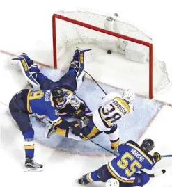  ??  ?? ST LOUIS: Viktor Arvidsson, Jake Allen, Jay Bouwmeeste­r, Colton Parayko Nashville Predators’ Viktor Arvidsson, (38), of Sweden, scores a goal past St. Louis Blues goalie Jake Allen (34) as Jay Bouwmeeste­r (19) and Colton Parayko (55) defend during the...