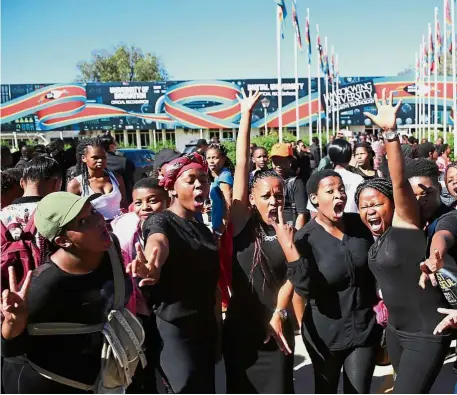  ??  ?? It was a carnival-like atmosphere as excited students wait for Lim’s arrival at the Swaziland campus.