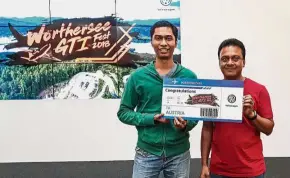  ??  ?? Syazwan (left) receiving his prized reward from VPCM aftersales director Deenan Nadar.