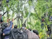  ?? AP FILE ?? A militant fires in the air at the funeral of ‘commander’ Saddam Padder in Heff village, south of Srinagar, on May 6.