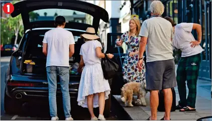  ??  ?? WILLING EVES: The whole family – including the dog, with mum Sharon – help Alice load her things into the 4x4 1