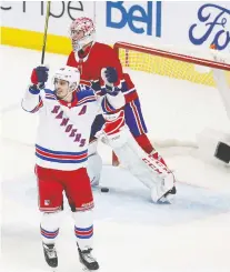  ?? PIERRE OBENDRAUF ?? Carey Price skates away from his net as New York’s Chris Kreider celebrates a goal from teammate Ryan Strome. The Canadiens have lost a league-high 10 games in which they led after two periods.