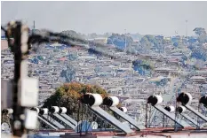  ?? | African News Agency (ANA) File ?? SOLAR panels above rooftops of the housing complex in Eastbank, Alexandra, Johannesbu­rg. Similar solar systems could be the answer to high electricit­y bills and expansion of power delivery in rural and poorer areas.