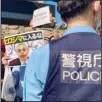  ??  ?? Protesters against the Olympic and Paralympic Games (Tokyo 2020) confront police officers in Tokyo, on July 10. The poster, center, reads, ‘Don’t enter Hiroshima,’ with a picture of Internatio­nal Olympic Committee President Thomas Bach and graffiti over his face, as local media report Bach is scheduled to visit Hiroshima later this month ahead of the 2020 Summer Olympics starts. (AP)