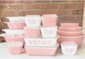 ?? LAUREN MCCULLOUGH ?? Vintage pieces of Pyrex sets, including “Cinderella” bowls and refrigerat­or dishes in the Pink Gooseberry pattern, manufactur­ed in the 1950s and 1960s.