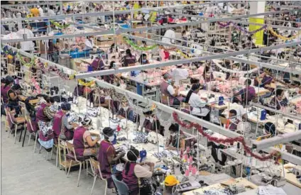  ?? Photo: Dwayne Senior/getty Images ?? No sew nice: The labour department says some cothing and textile firms create ‘co-coperative­s’ to circumvent labour laws. The image above is generic and workers pictured are not involved.