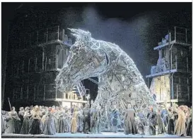  ??  ?? OPENING SCENE of Berlioz’s massive “Les Troyens” in San Francisco features a Trojan horse that is an evil-looking machine housing watch-works innards.