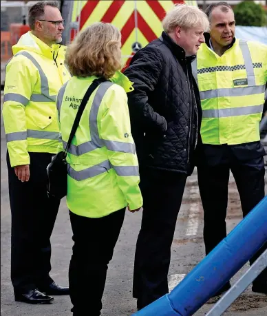  ??  ?? Eye of the storm: Boris Johnson is shown flood defences in Bewdley, Worcesters­hire,