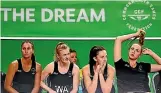  ??  ?? Silver Ferns Ameliarann­e Ekenasio, left, Shannon Francois, Bailey Mes and Kelly Jury look on from the bench during the loss to England.