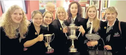  ??  ?? Winning Percussion Section and Tenor Horn Soloist Tongwynlai­s Temperance Band Girls. From left, Ffion Haf Williams, Ellen Waite, Georgina Evans, Michelle Williams, Chelsea James, Emily Evans and Jenny Jones (secretary)