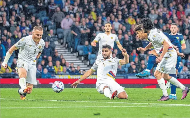  ?? ?? SCOTLAND CHANCE: Che Adams tries his luck on goal as Scotland return to winning ways after the disappoint­ment of losing to Ukraine last week.