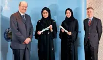  ??  ?? Fatima Buali and Lubna Osama with senior officials of Emirates NBD.