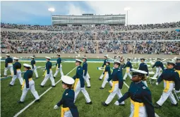  ?? CHANCEY BUSH/THE GAZETTE 2021 ?? Cadets make their way to their seats at the Air Force Academy’s graduation ceremony in Colorado Springs, Colorado.