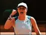  ?? Thibault Camus / Associated Press ?? Iga Swiatek clenches her fist after defeating Jessica Pegula during their quarterfin­al match at the French Open on Wednesday.