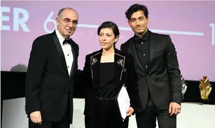  ?? Photograph: Daniele Venturelli/Getty for the Red Sea Internatio­nal Film Festival ?? Darin Sallam, centre, receives the special mention award for Farha at the Red Sea Internatio­nal film festival in Saudi Arabia in December.