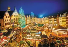  ?? ?? explore a traditiona­l Christmas market in the historic centre of Frankfurt.