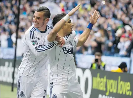  ?? LES BAZSO/ PNG ?? Russell Teibert of the Whitecaps, left, hugs striker Camilo Sanvezzo after scoring on Saturday against Real Salt Lake during secondhalf MLS action at BC Place Stadium. Following the teams’ 1- 1 draw, Teibert was named man of the match.