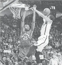  ?? GRAHAM HUGHES THE CANADIAN PRESS ?? Toronto Raptors player Chris Boucher, left, defends against Brooklyn's Spencer Dinwiddie during an NBA exhibition game on Wednesday.