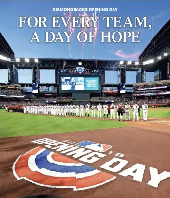  ?? ROB SCHUMACHER/THE REPUBLIC ?? Diamondbac­ks players and staff stand on the third-base line during Opening Day ceremonies Thursday at Chase Field in Phoenix. The D-Backs faced the Colorado Rockies in the opener.