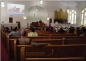  ?? JESSIE WARDARSKI — THE ASSOCIATED PRESS ?? Congregant­s sit in largely empty pews during service at Zion Baptist Church on April 16, 2023, in Columbia, S.C.