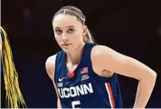  ?? G Fiume/Getty Images ?? UConn coach Geno Auriemma thinks it’s a long shot the Huskies can win a national title, but Paige Bueckers isn’t giving up hope just yet.