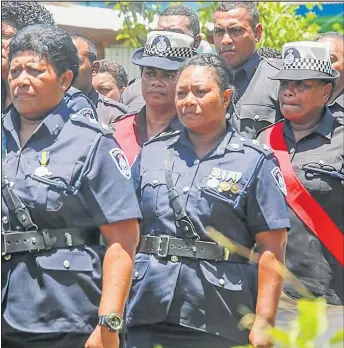  ?? Picture: FIJI POLICE FORCE. ?? Senior women officers pay their last respects during the funeral of a fallen comrade.