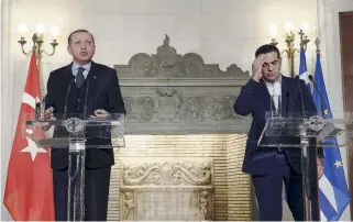  ??  ?? Recep Tayyip Erdogan (l) speaks yesterday during a joint press conference with Greek Prime Minister Alexis Tsipras. Erdogan is due to conclude his trip today with a visit to the Muslim minority in Thrace, northern Greece.