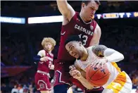  ?? AP photo/Wade Payne ?? ■ Tennessee guard Lamonte Turner (1) drives against South Carolina forward Felipe Haase (13) during the second half Wednesday in Knoxville, Tenn. Tennessee won, 85-73.