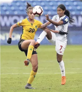  ?? FILE ?? Jamaica midfielder Giselle Washington (left) and Panama midfielder Kenia Rangel battle for the ball during the first half of the third-place match of the CONCACAF women’s World Cup qualifying tournament on Wednesday, October 17. The Reggae Girlz won the game on penalties to qualify for their first ever FIFA Women’s World Cup, to be staged in France, next year.