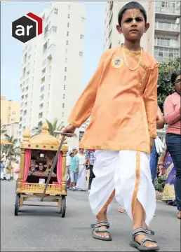  ?? PICTURE: MOTSHWARI MOFOKENG/AFRICAN NEWS AGENCY (ANA) ?? The Hare Krishna Festival of Chariots started with a float procession along the Durban beachfront in the OR Tambo Parade on Friday. In the picture is Sridham Natalie pulling a miniature chariot.